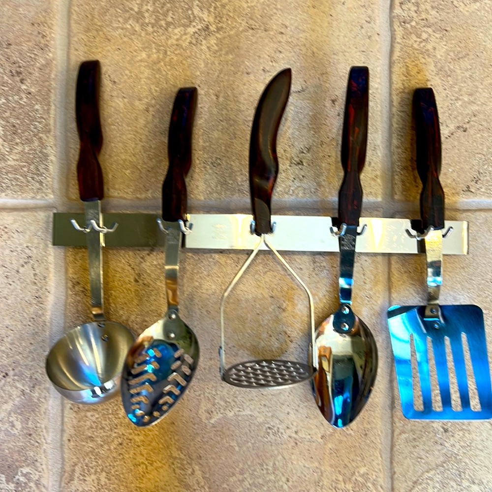 Cutco Kitchen Utensils complete with wall-hanging rack.